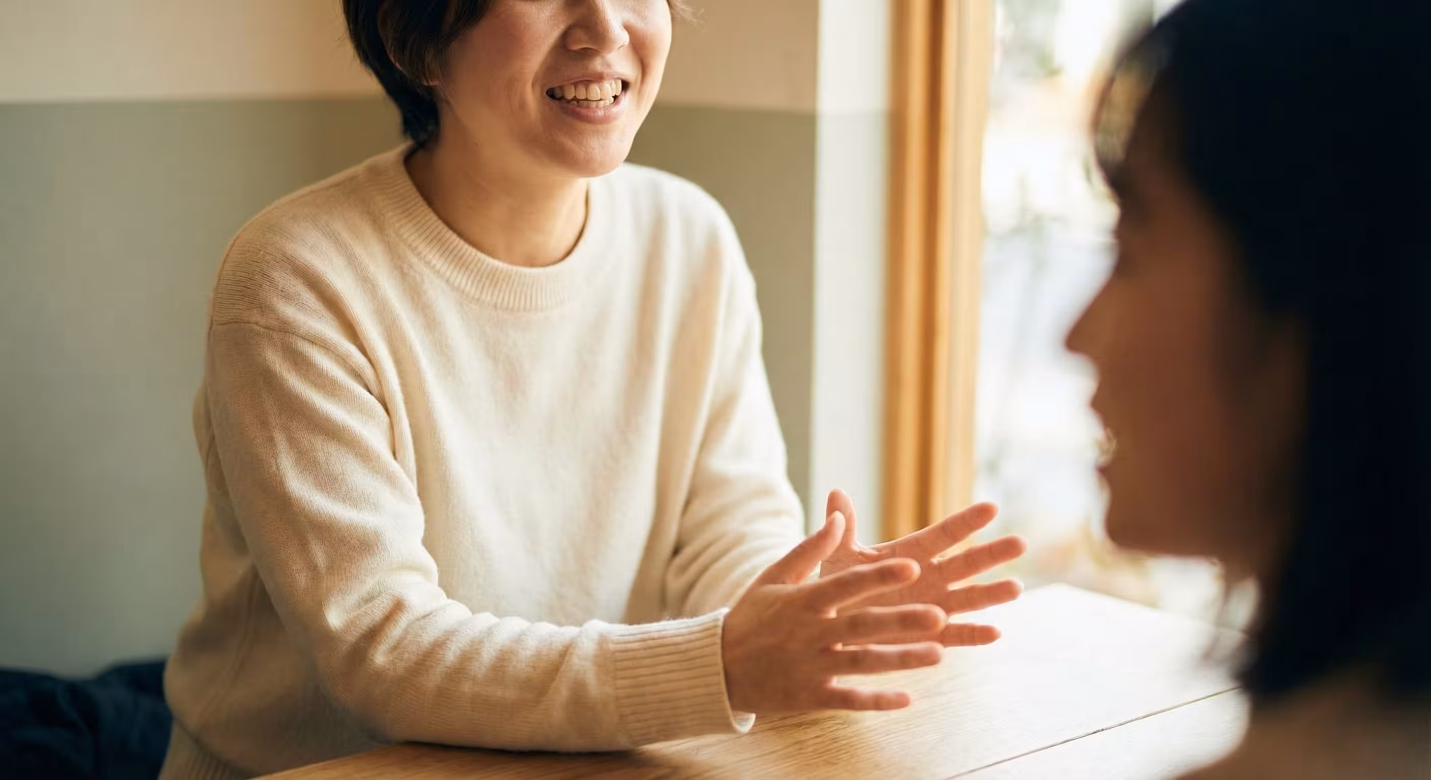 Two people in a warm, natural conversation